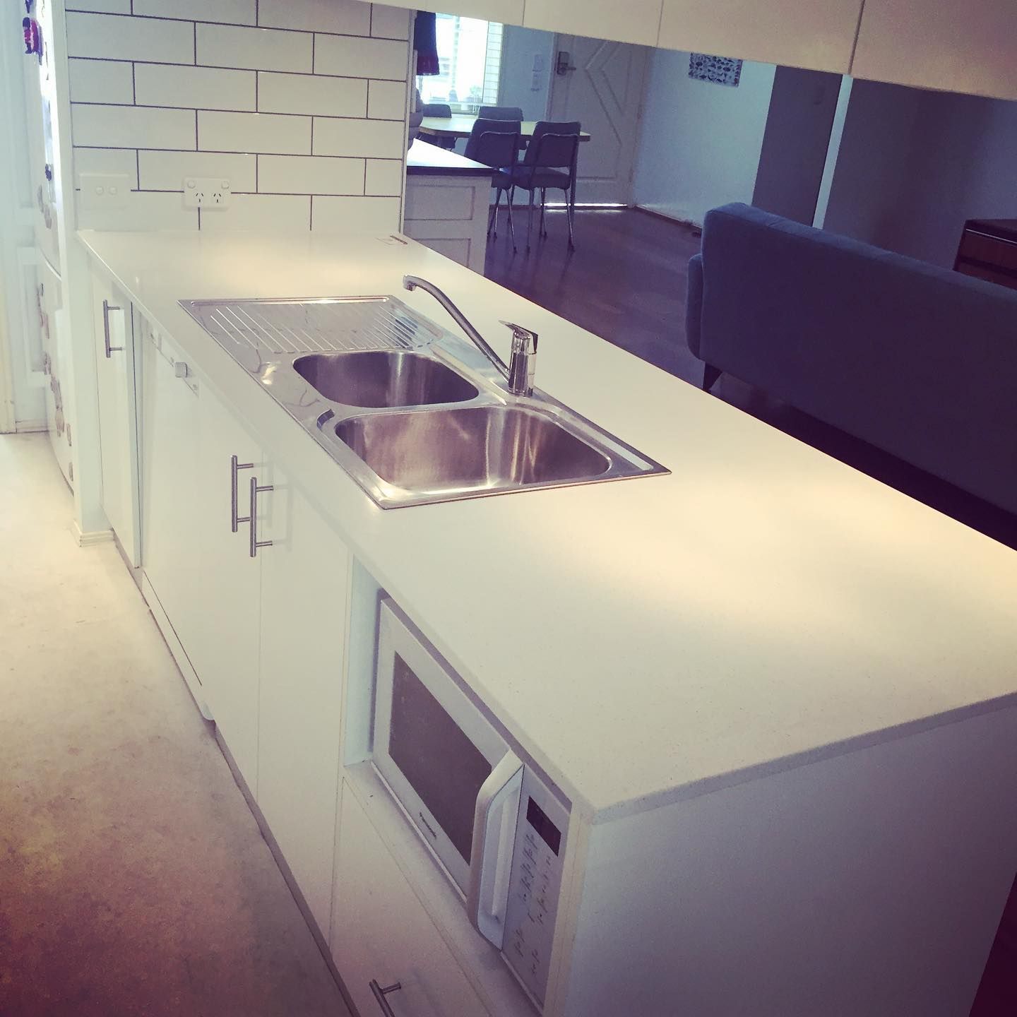 A Kitchen With Two Sinks and a Microwave — Lennox Build In Ballina, NSW