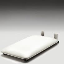 A white mattress is sitting on top of a white surface.