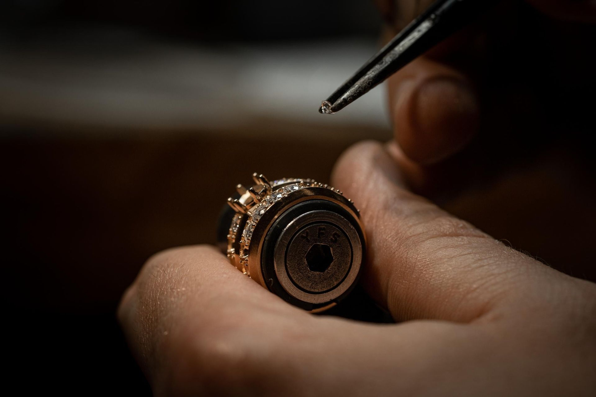 A close up of a person holding a ring on their finger.