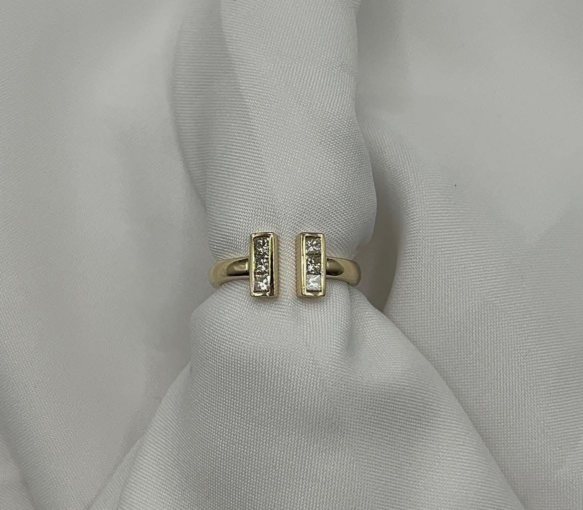 Custom made bar style ring with princess cut diamonds.