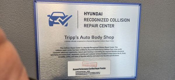 Plaque for Hyundai Recognized Collision Repair Center at Tripp’s Auto Body Shop, with blue logo and silver frame | Tripp's Auto Body