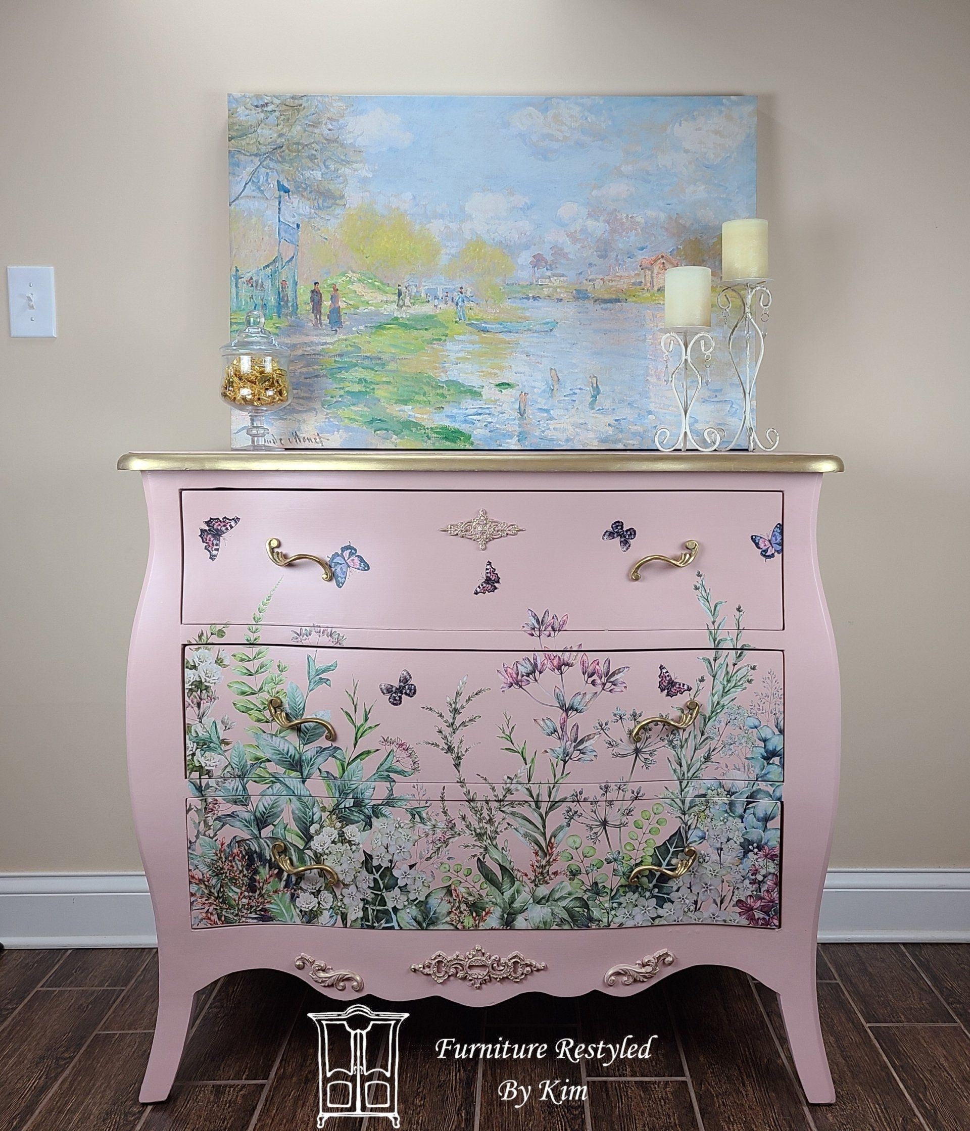 pink dresser with butterfly and floral paintings