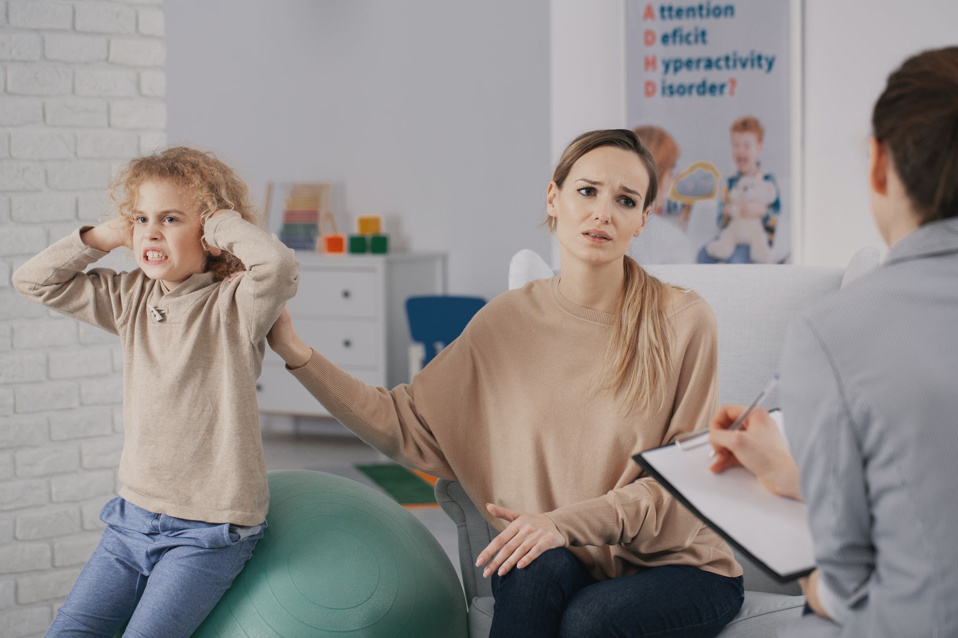 Child covering ears, mother concerned, and person with clipboard; in a room with ADHD sign.