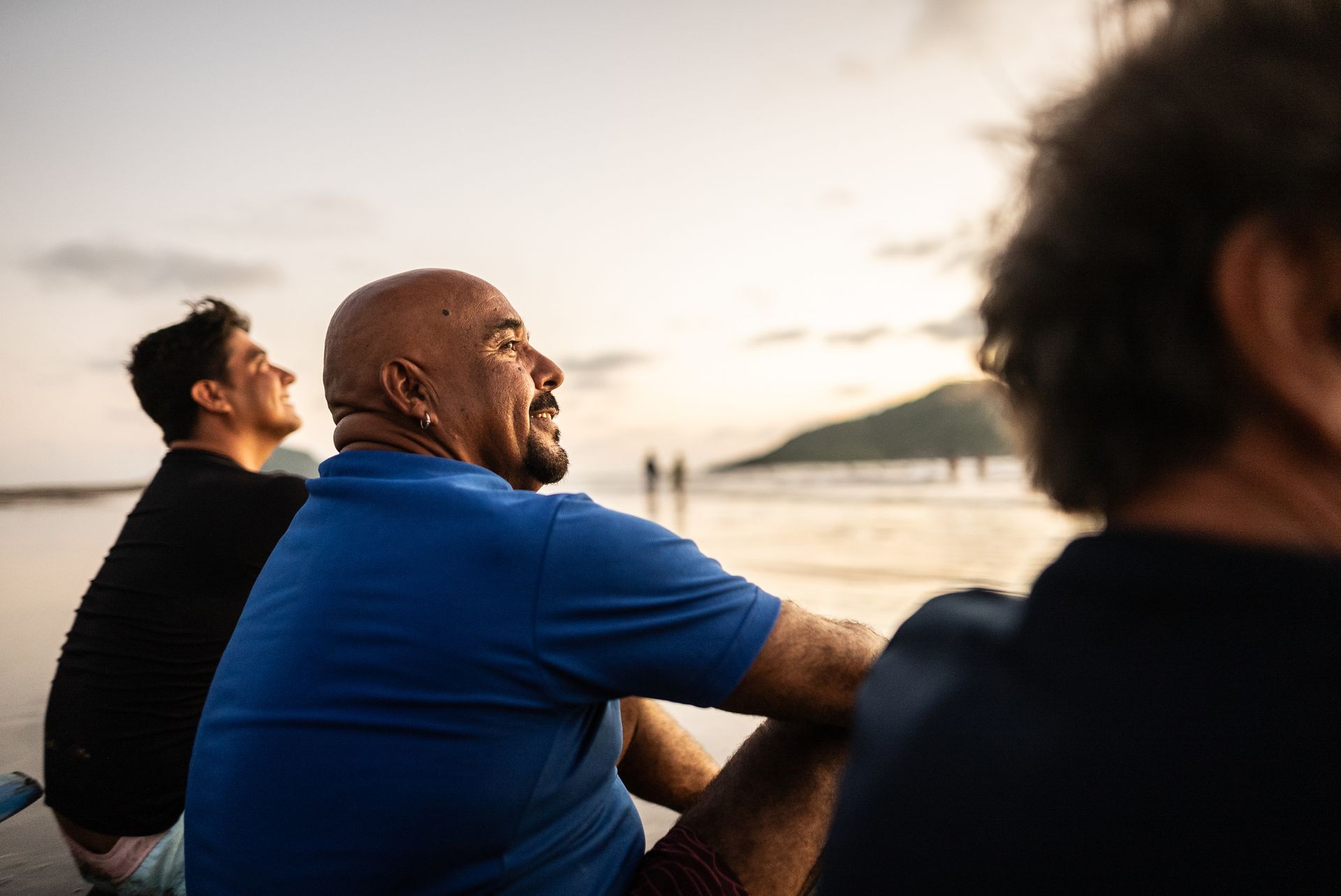 Herbal medicine supplies with notebook and pen on white wood table.