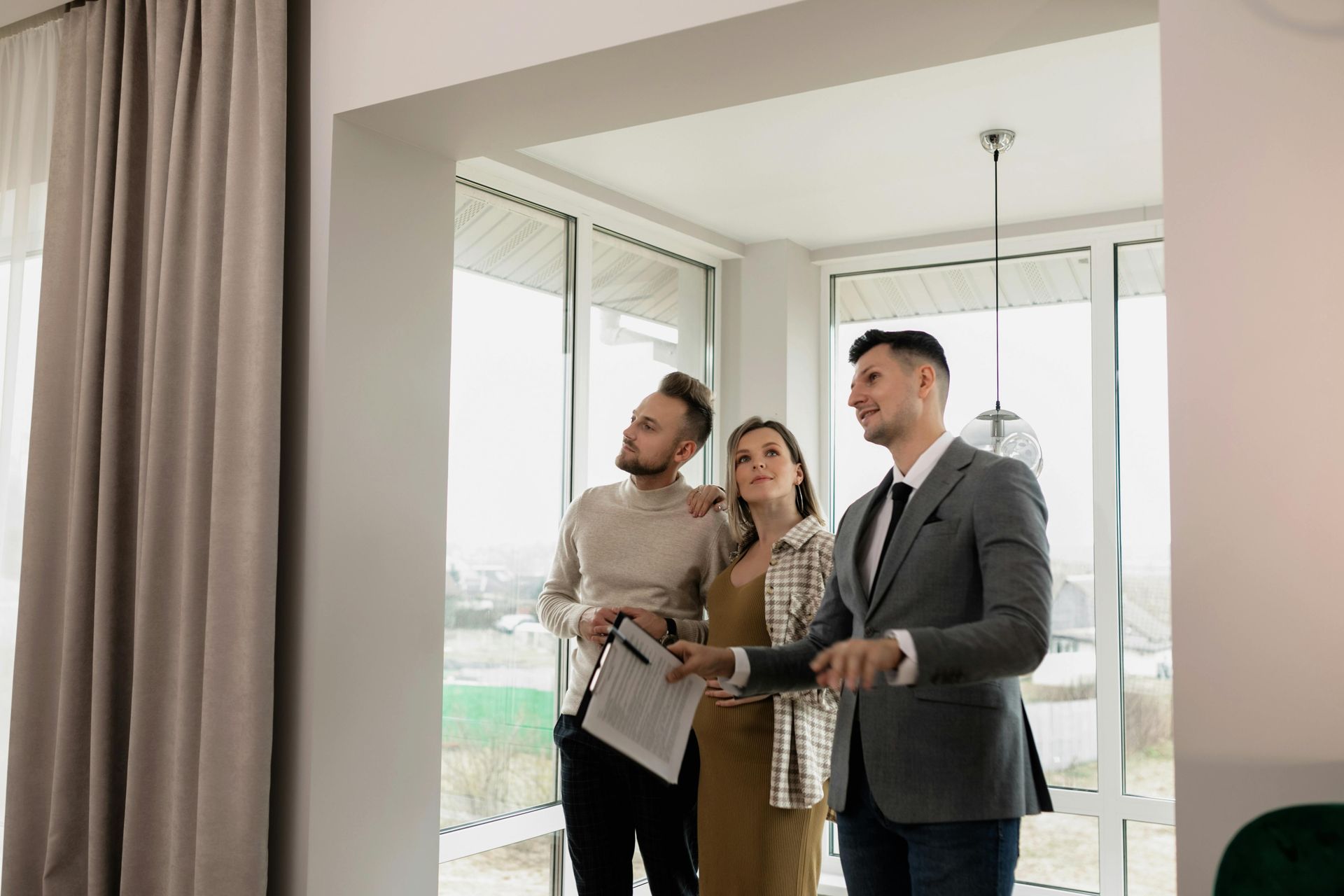 Real estate agent showing a couple an apartment