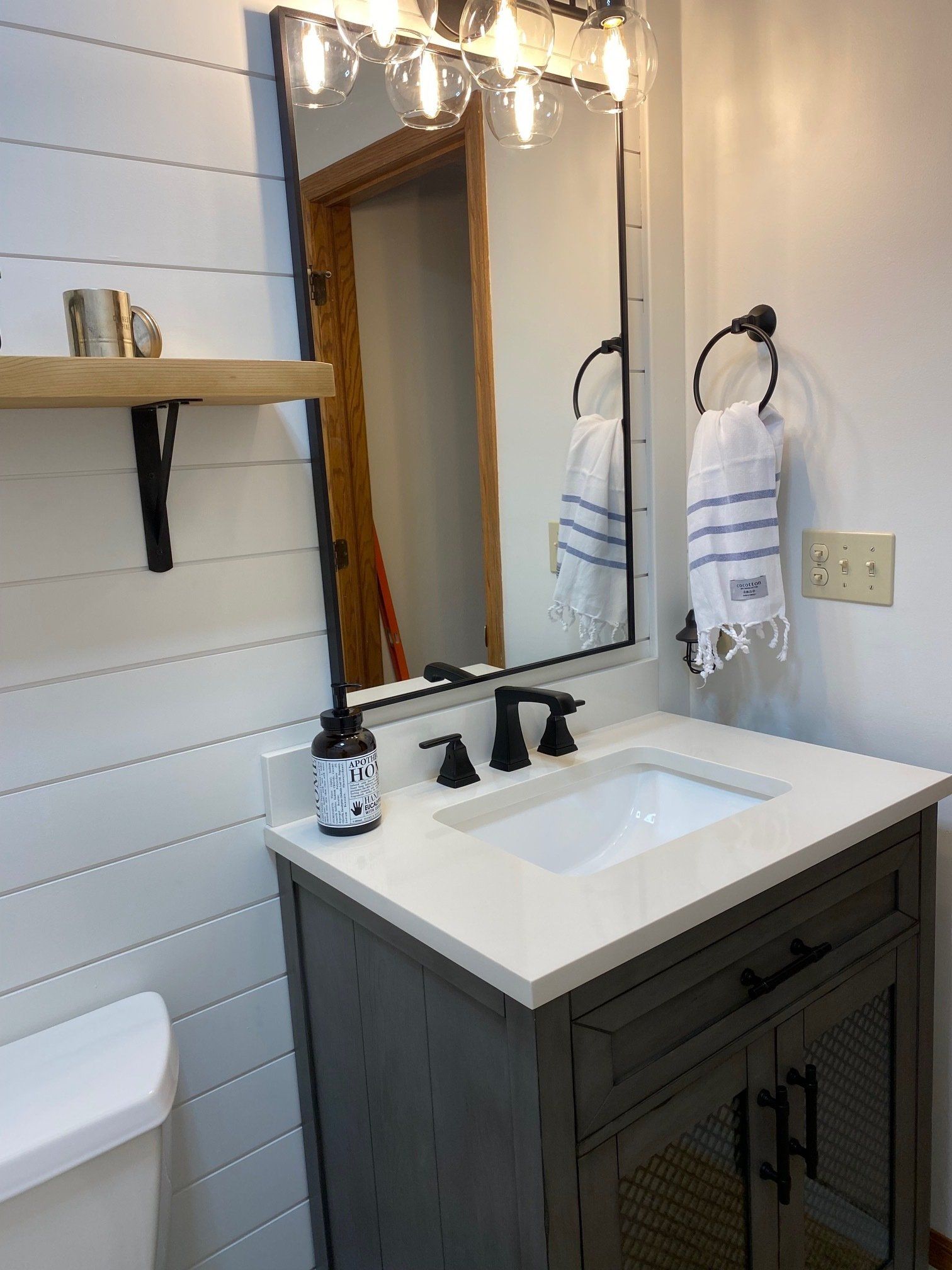 Small bathroom remodel with shiplap and matte black fixtures