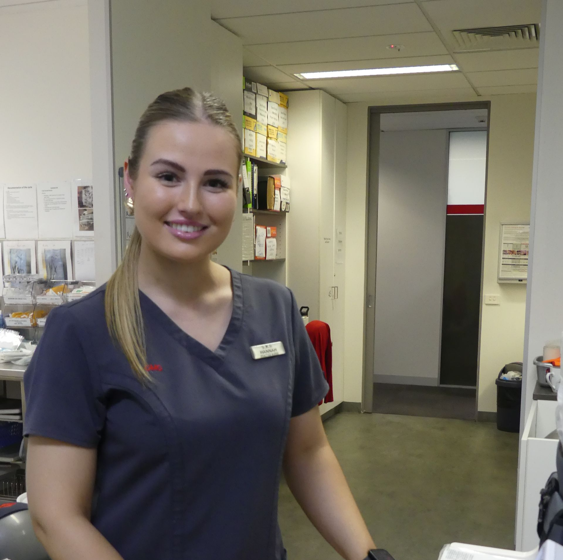 A group of nurses are standing next to each other in a hospital.