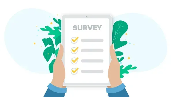 A person is holding a tablet with a survey on it. A person is holding a tablet with a survey on it.