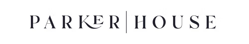 Logo for Parker House. Text in a serif font, with a stylized 'K'. Vertical line separates 