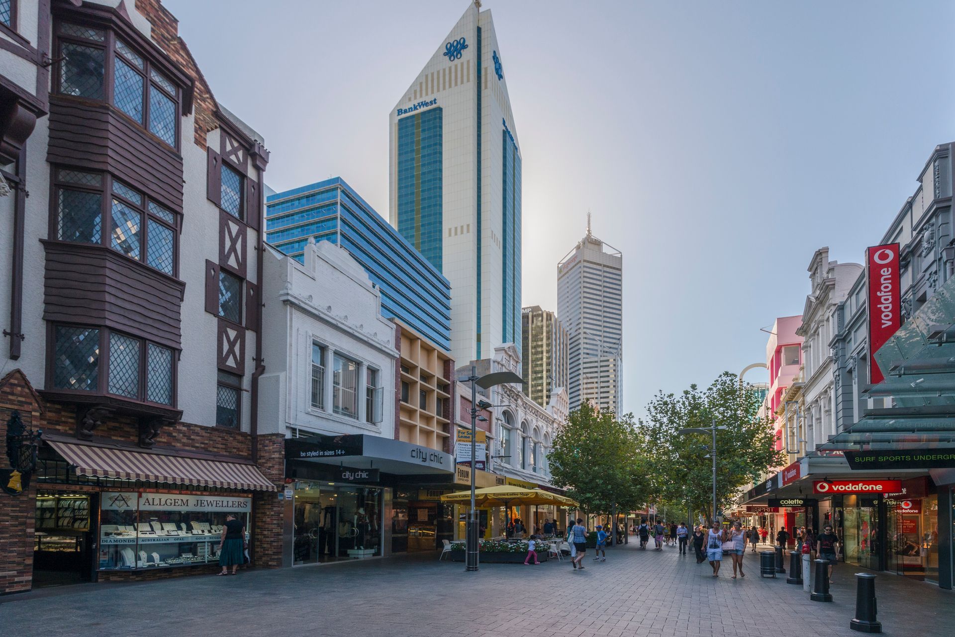 A bustling city street with shops and tall buildings in Perth, Australia.