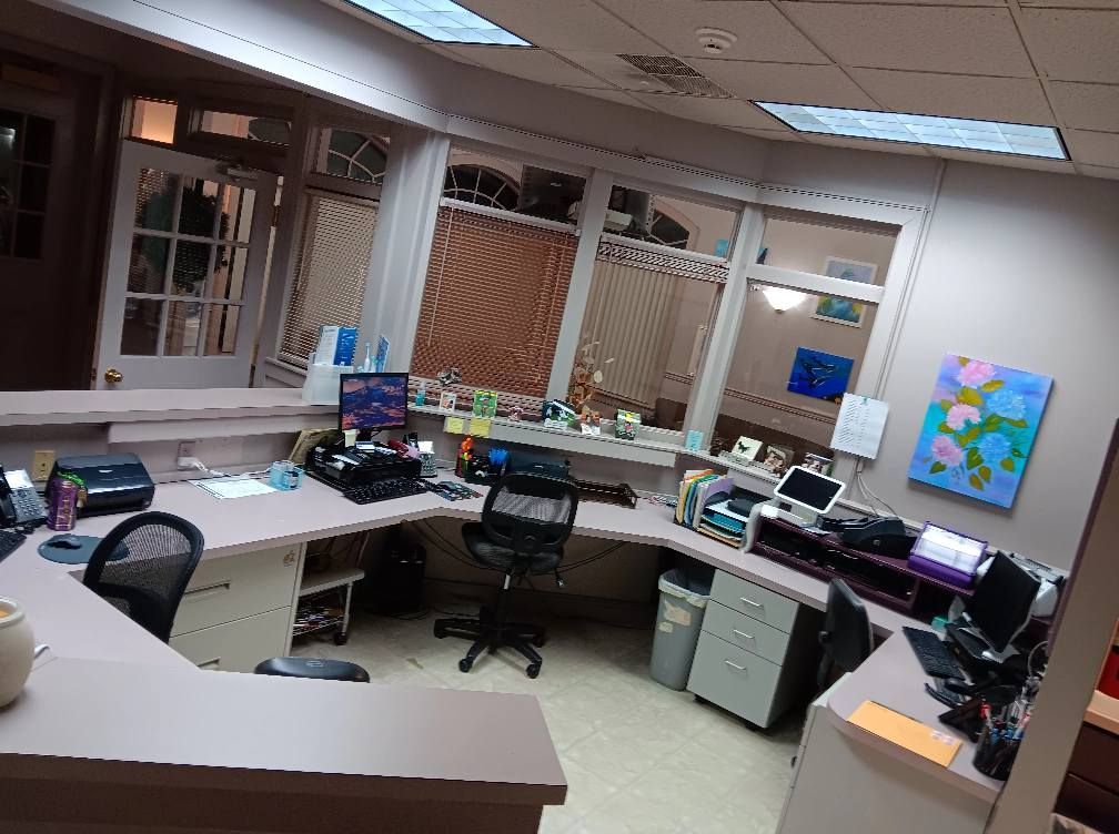 An office with a lot of desks and chairs