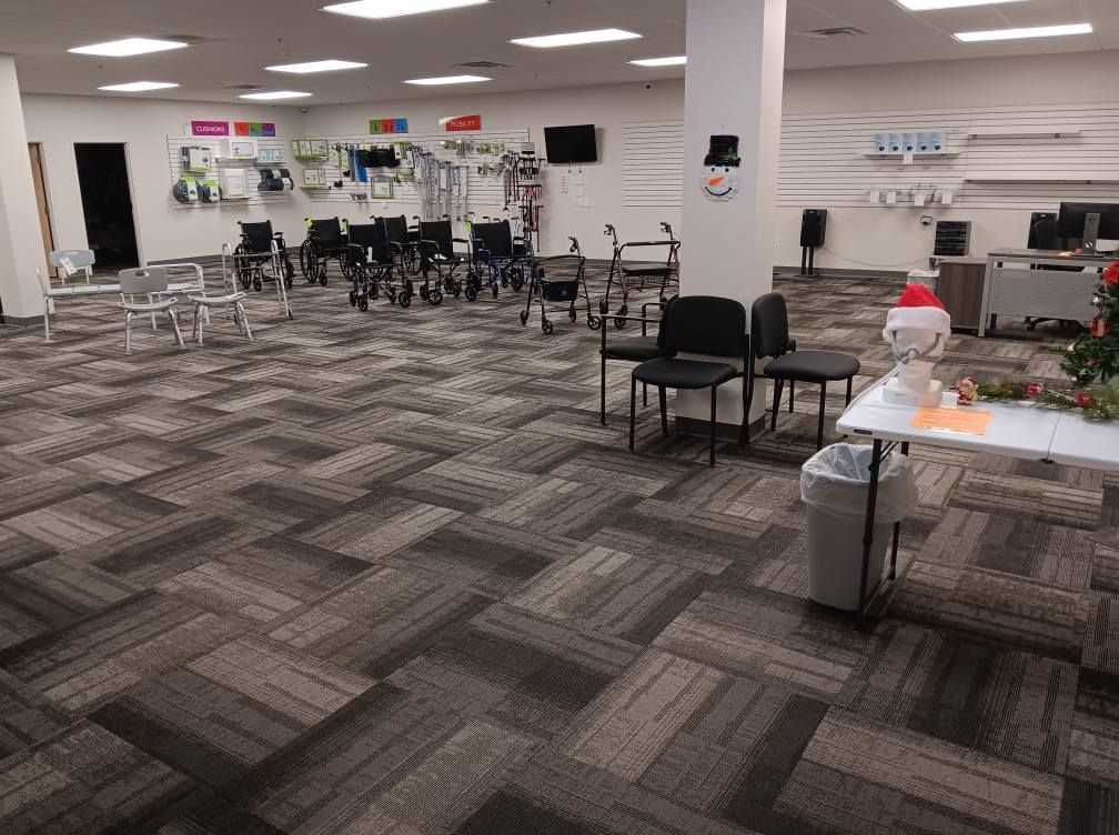 A large room with a lot of chairs and tables.