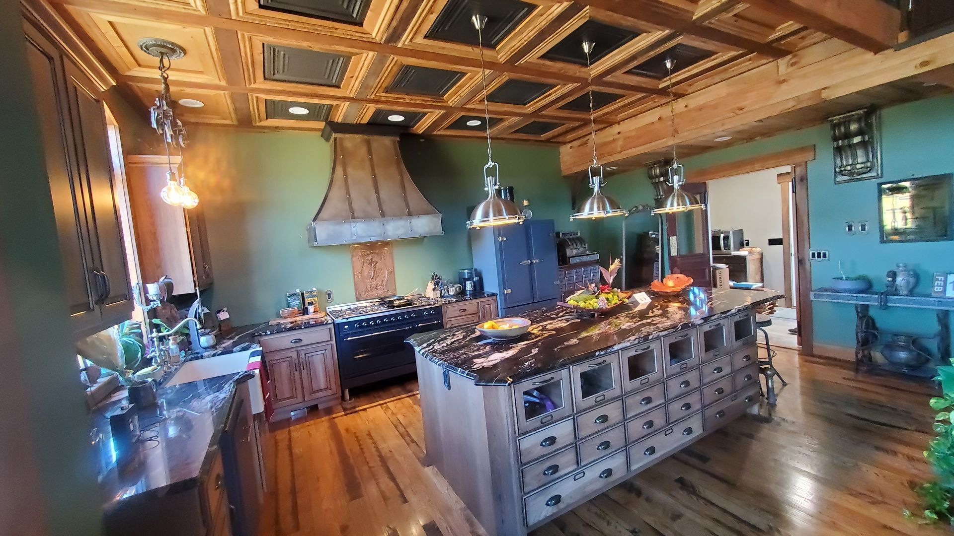 There is a large island in the middle of the kitchen.