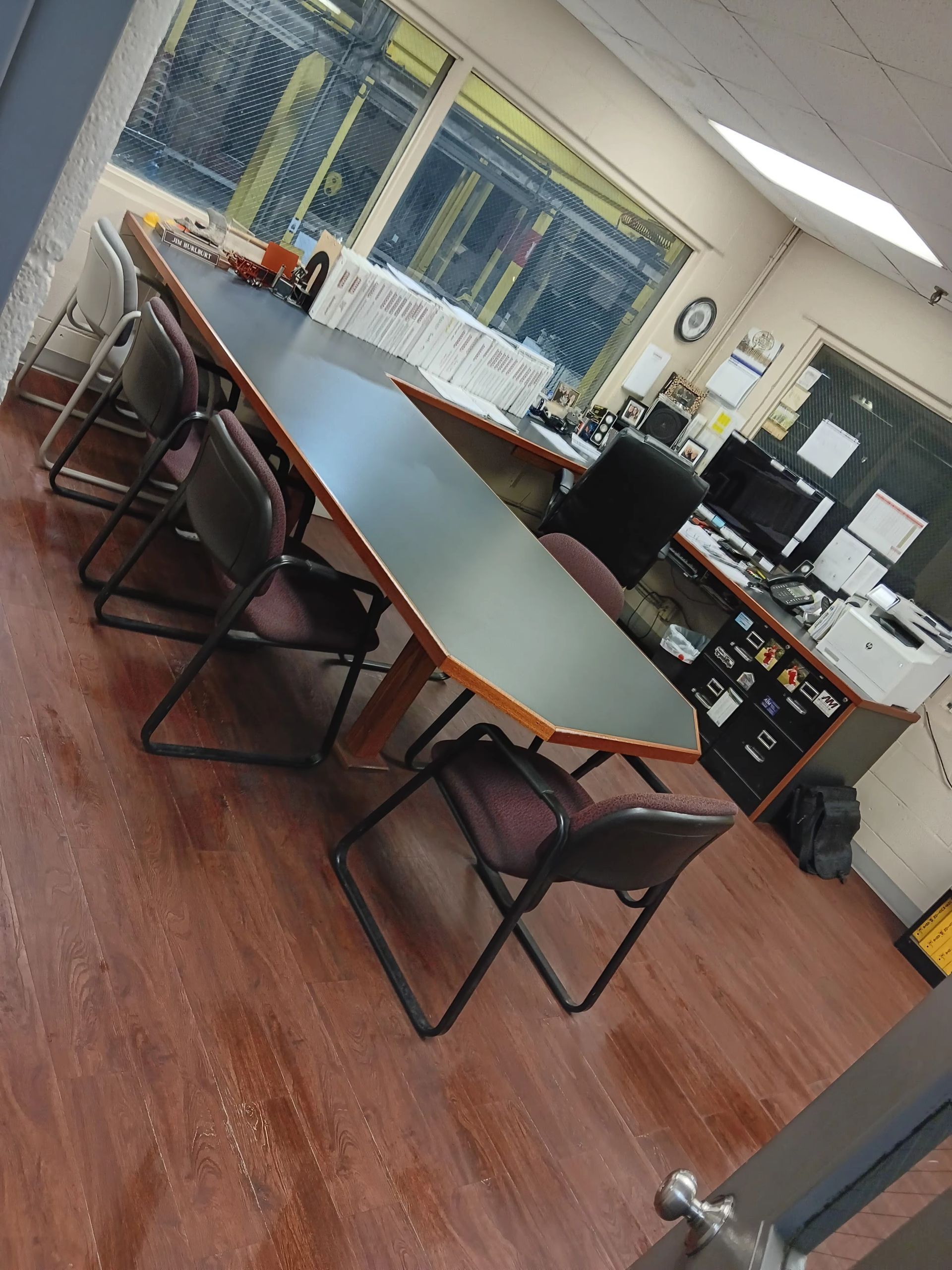 A conference room with a long table and chairs