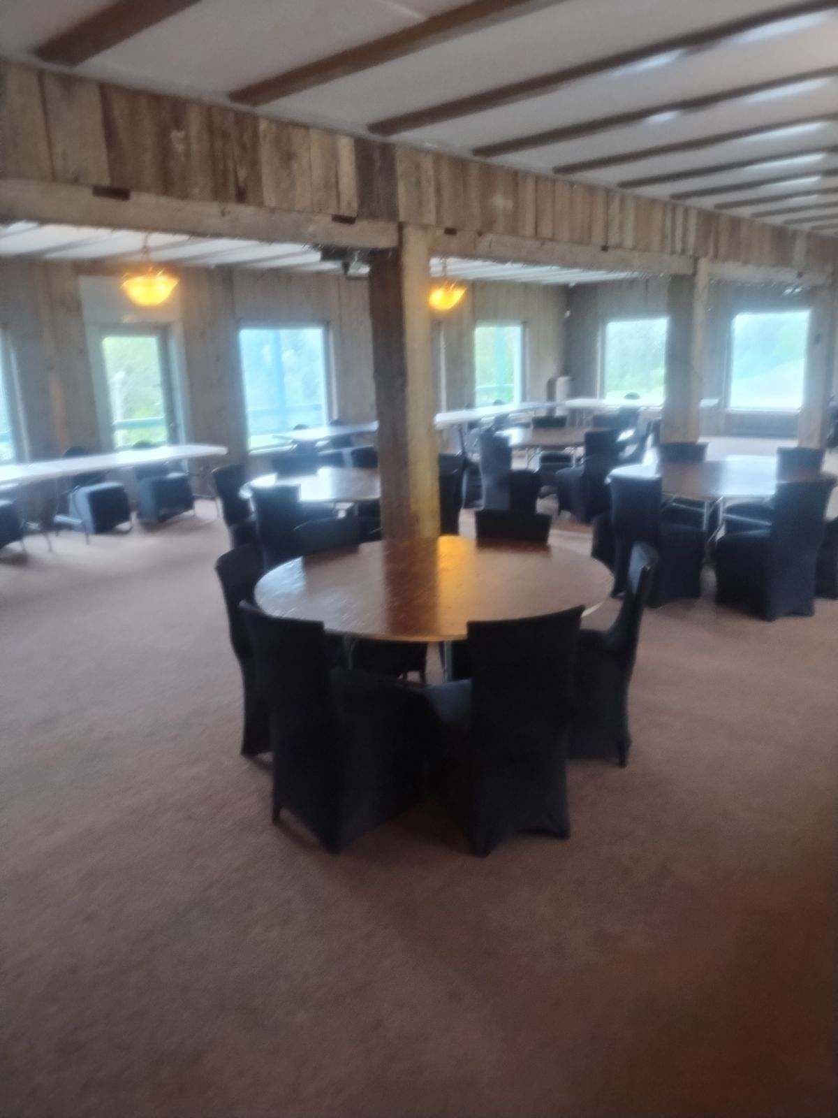 A large room with tables and chairs in it