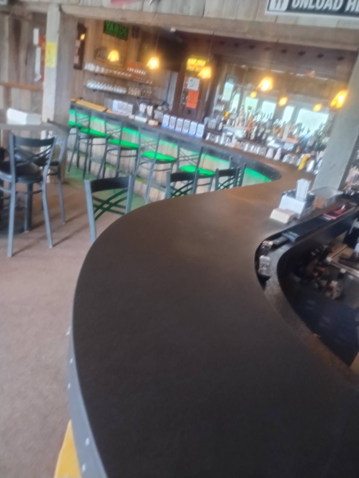 A restaurant with a sign that says unload here