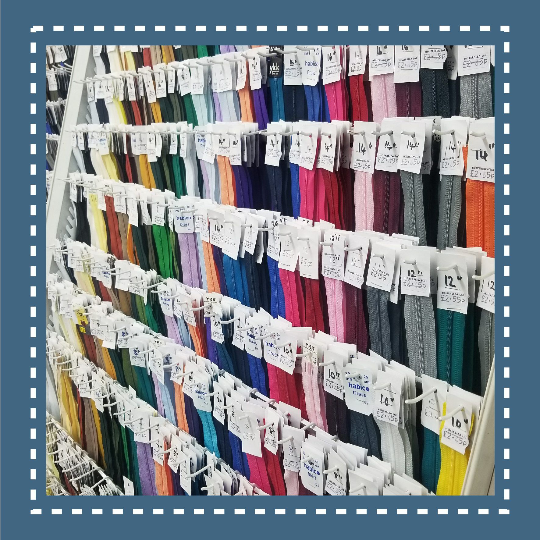 Shelves of colorful embroidery floss, arranged by color, with price tags.