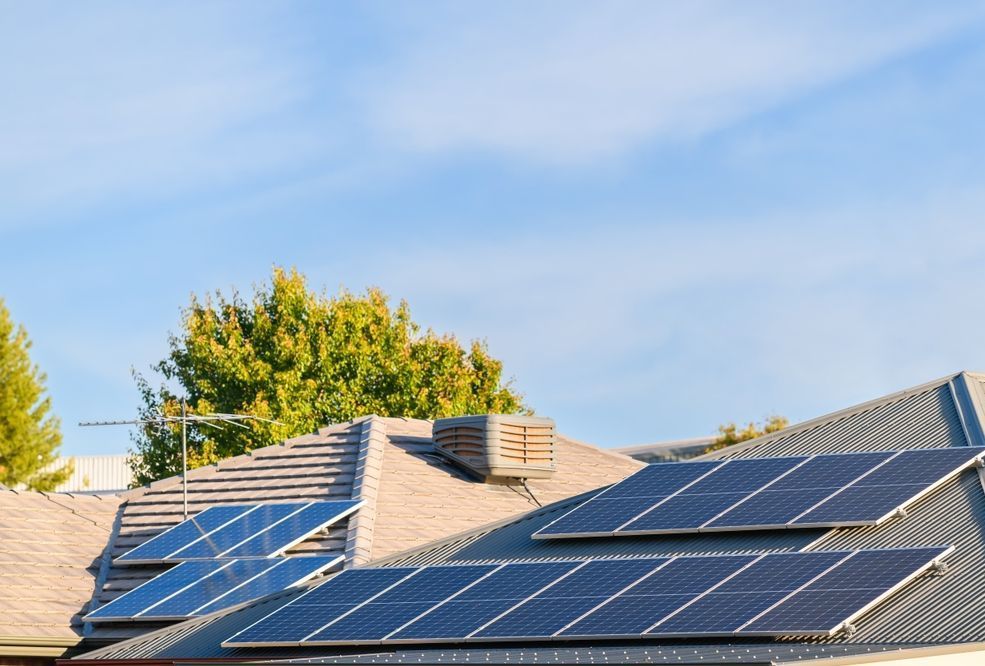 A Solar Water Heater is Sitting on Top of a White Roof — Burnett Home Energy Centre in Bundaberg Central, QLD