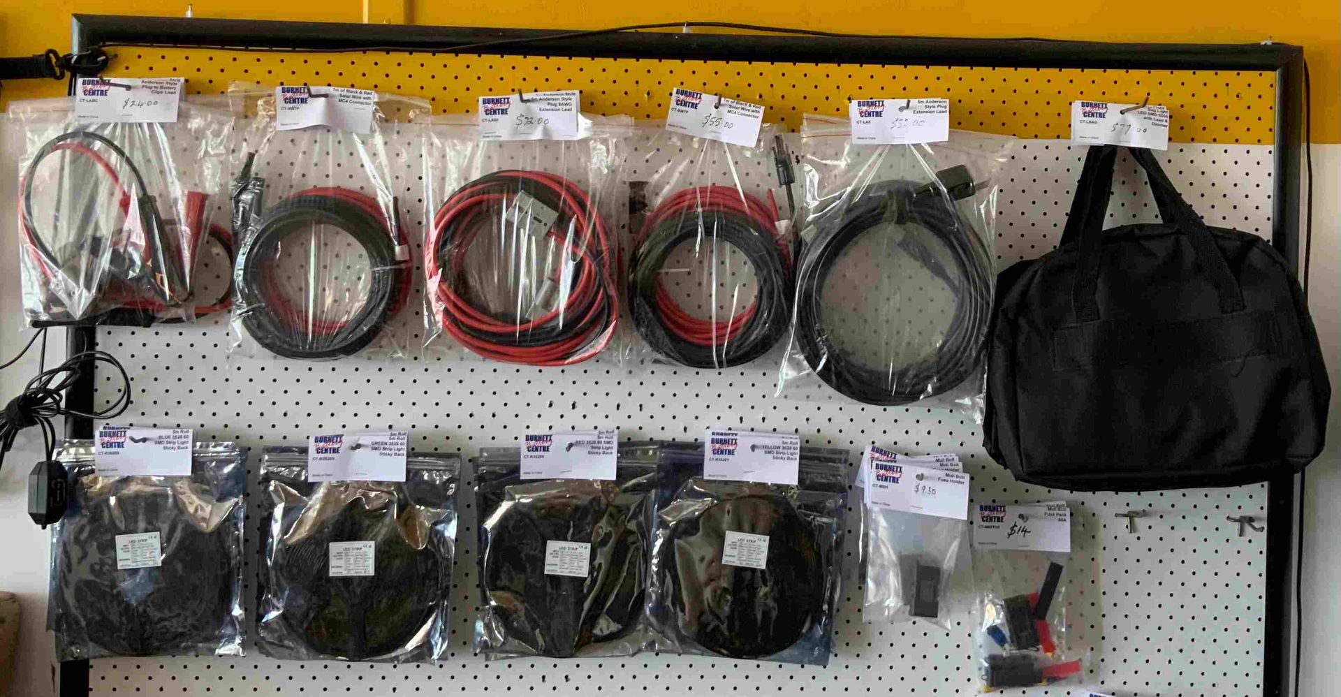 A Bunch Of Wires Are Hanging On A Wall Next To A Bag — Burnett Home Energy Centre In Bundaberg Central, QLD