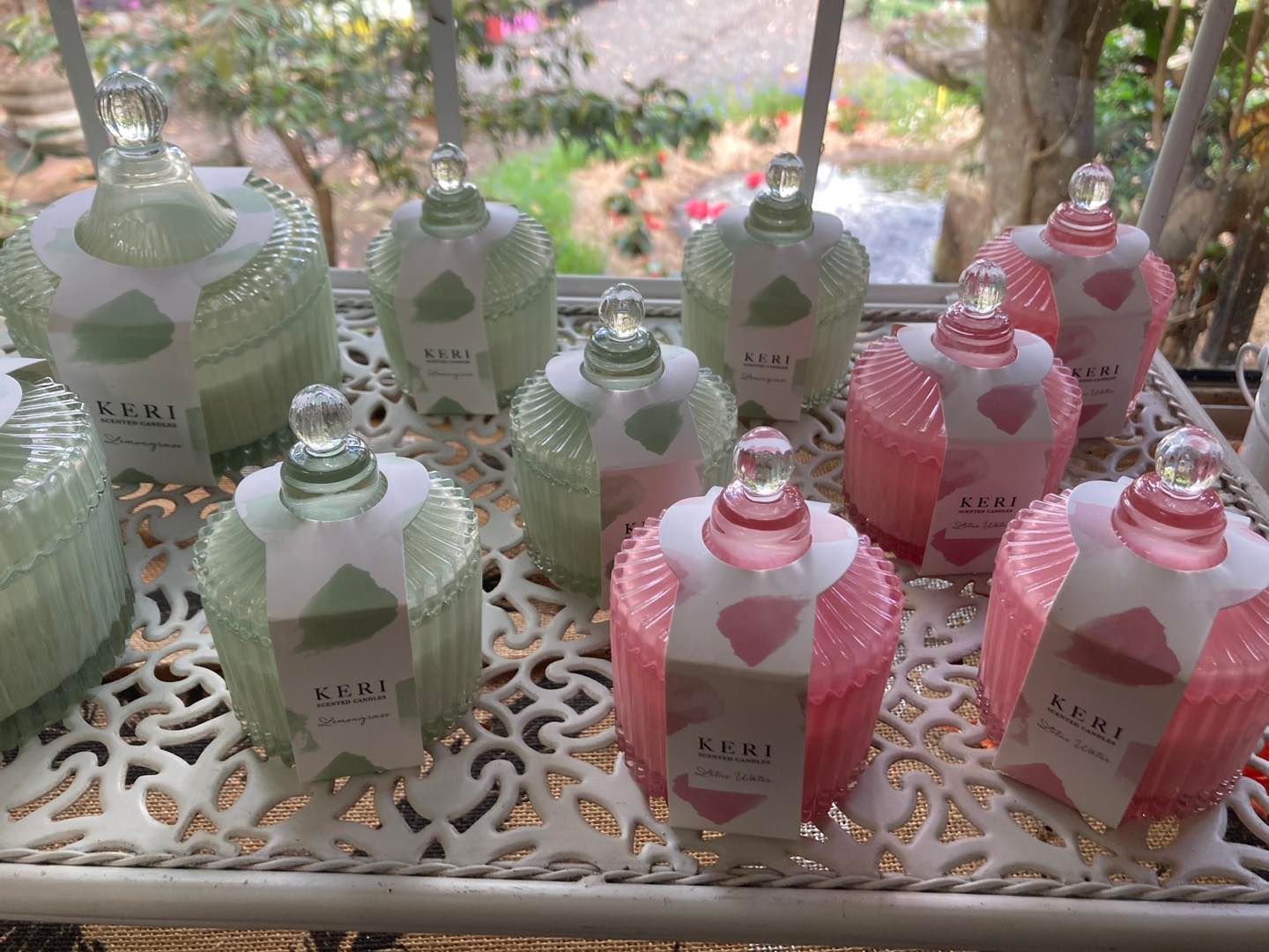A Bunch of Candles Are Sitting on a Table in Front of a Window — Wingham Nursery and Florist PTY Ltd In Wingham, NSW