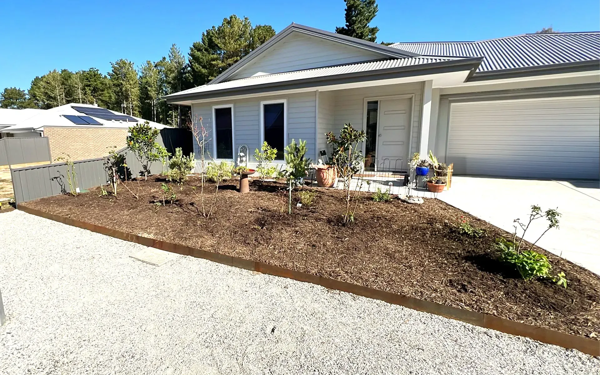 Landscaping project with garden beds, irrigation, paving, turf, shed installation in Creswick Vic
