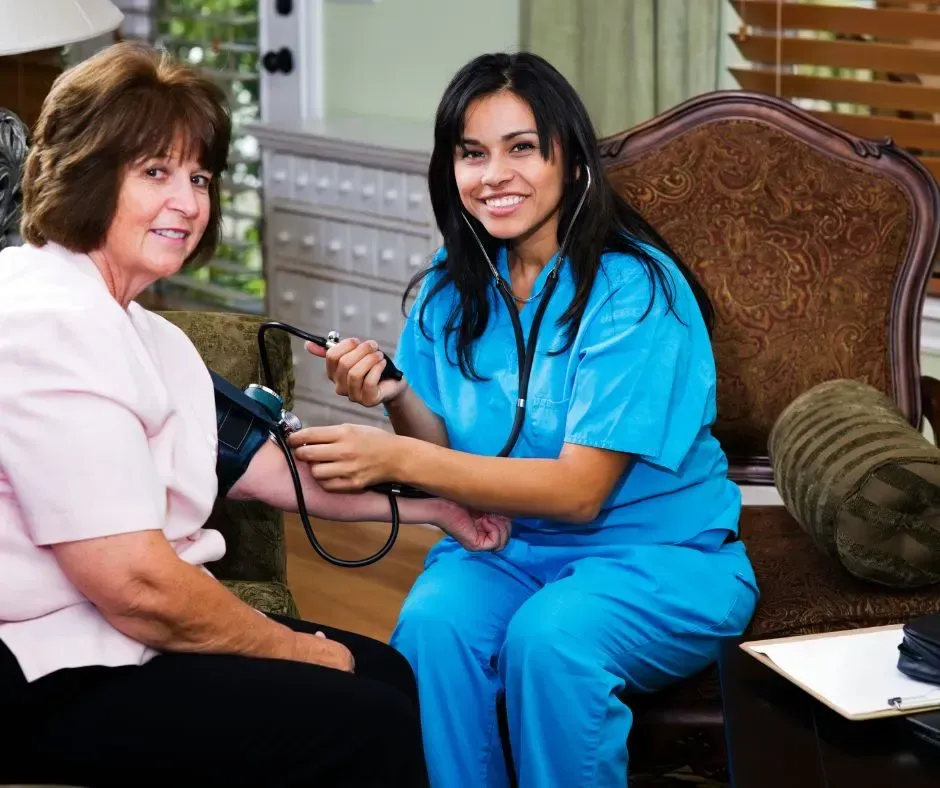 Nurse checking a patient’s blood pressure