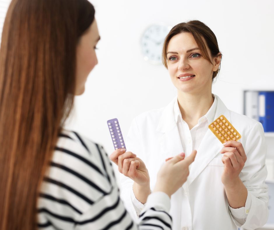 Doctor discussing birth control pills with a patient.