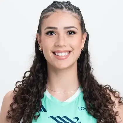 Smiling woman in a teal sports jersey with braided hair on a white background