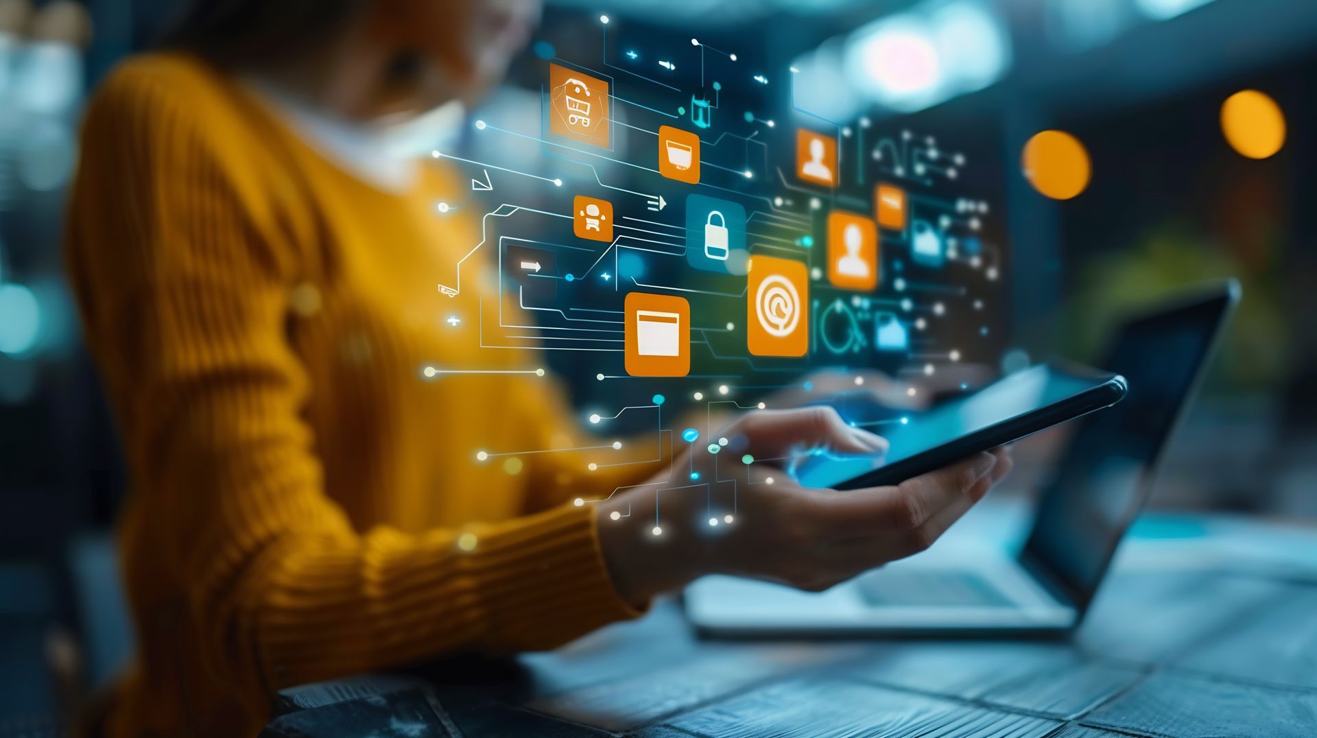 Woman using tablet and laptop, digital icons overlay, representing communication and data flow.