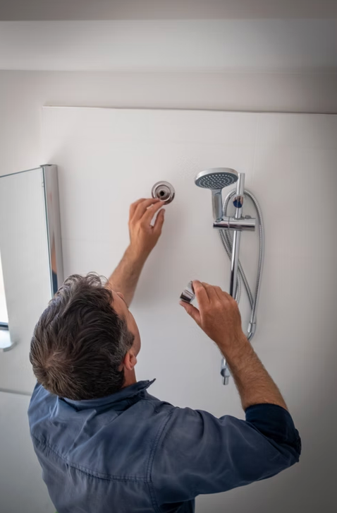A Plumber Uses a Wrench to Tighten a Fitting on a Residential Water Meter — Dunnerite Plumbing in Mount Peter, QLD