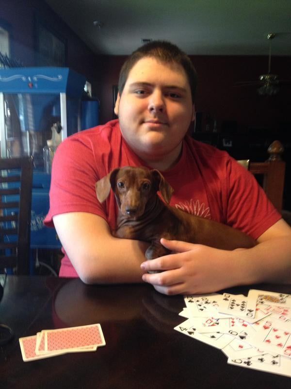 Boy with his new Dachshund puppy