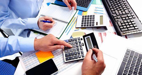 Financial experts calculating tax