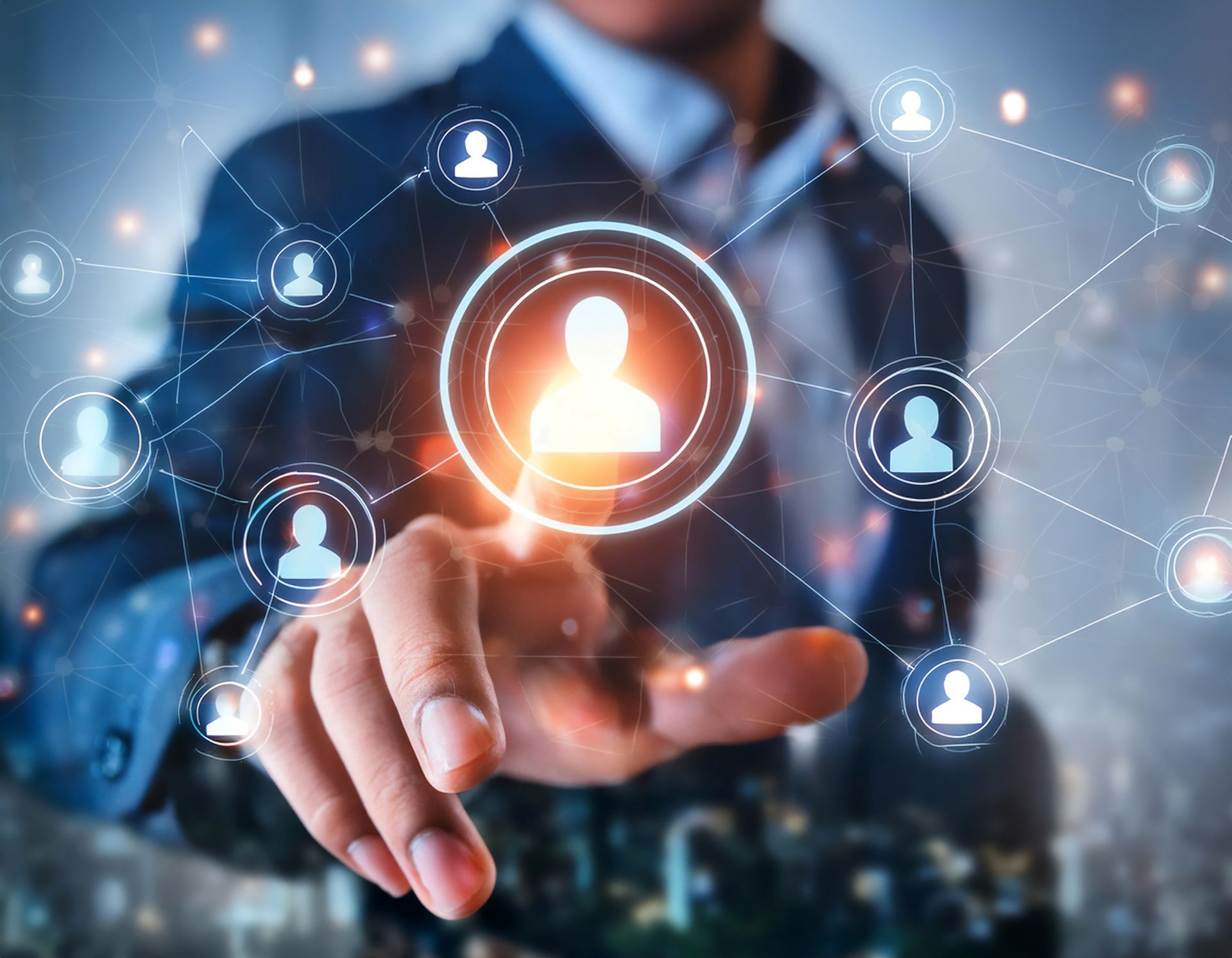 A man in a suit is pressing a button on a virtual screen.