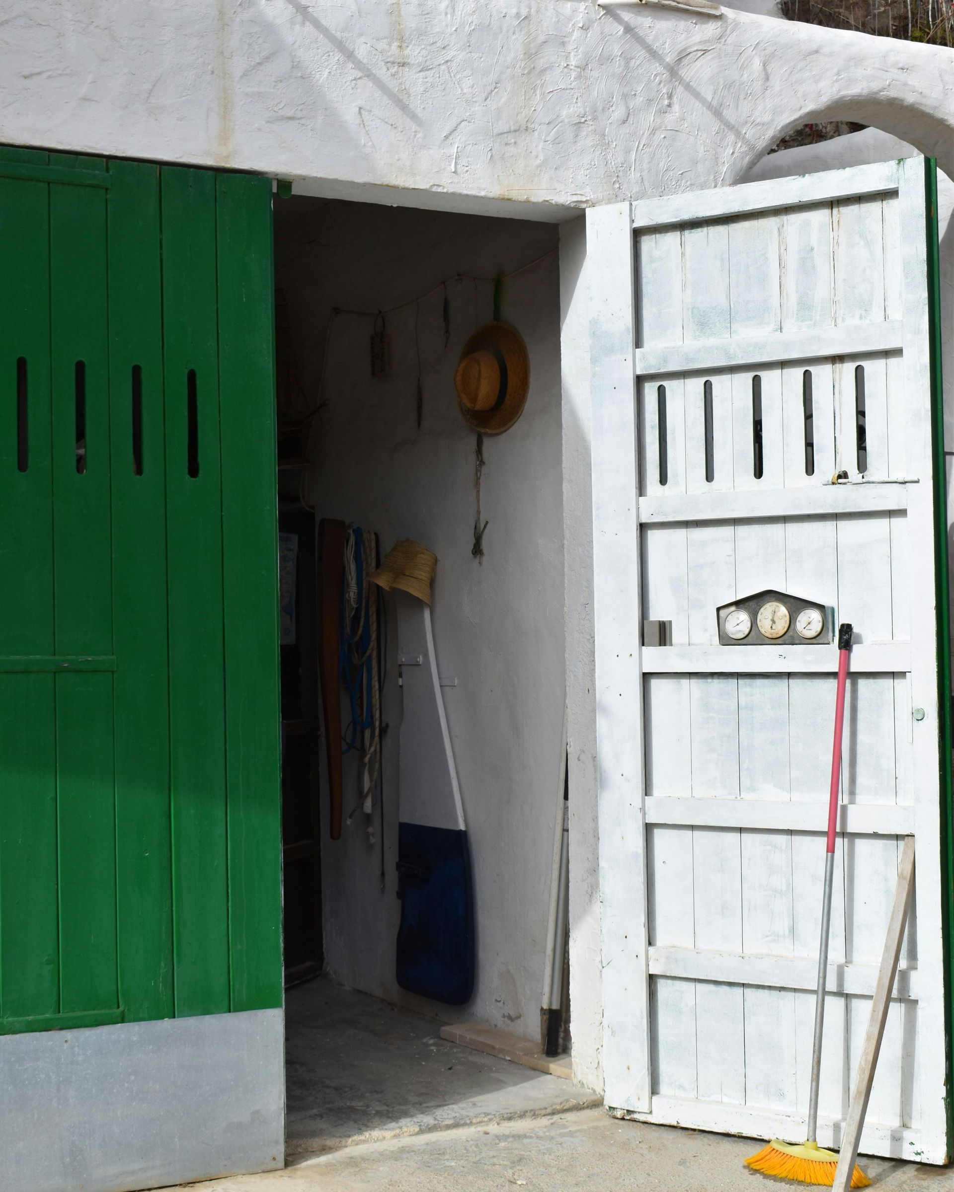 Green garage door with garage tools