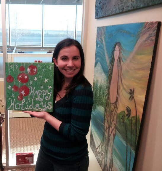 A woman holding a sign that says happy holidays