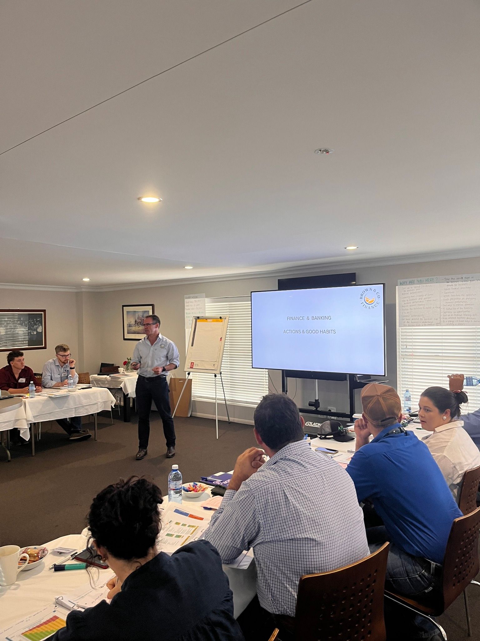 Man Standing In Front Of People At Seminar — Brown & Co Finance in Gatton, QLD