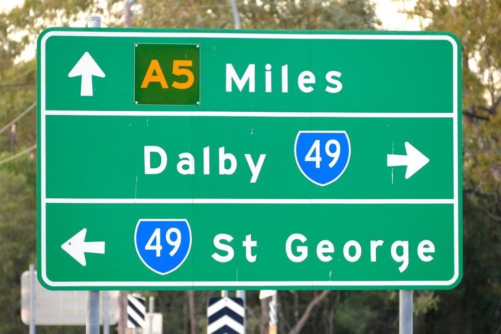 A Green Highway Sign that Says A5 Miles and Dalby 49 — Brown & Co Finance in Dalby, QLD