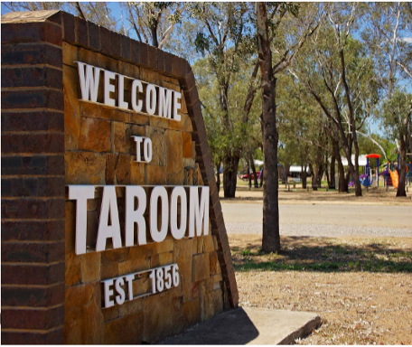 A Wooden Picnic Table With A View Of A Field And Mountains In The Background — Brown & Co Finance in Taroom, QLD