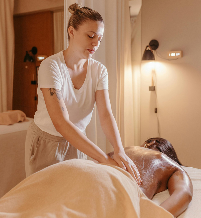 Professional assisted leg stretching for improved flexibility.