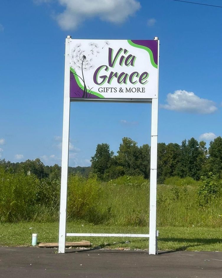 A large sign for via grace gifts and more