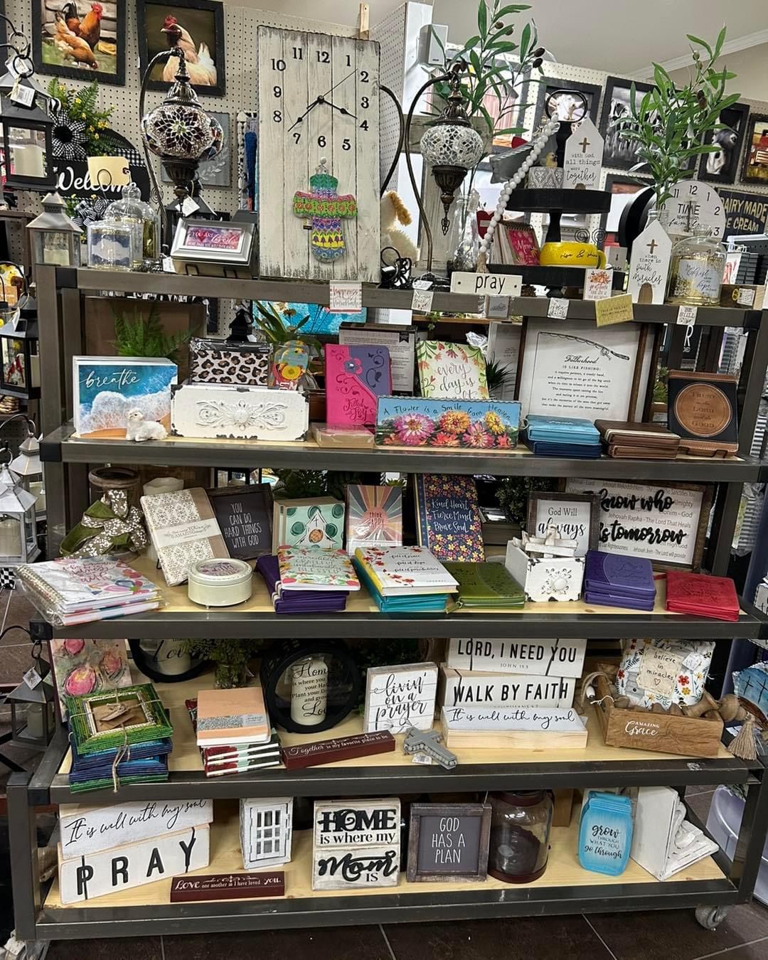 A shelf filled with lots of signs and decorations in a store.