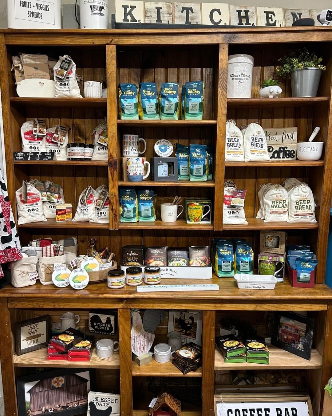A wooden shelf filled with lots of kitchen items.