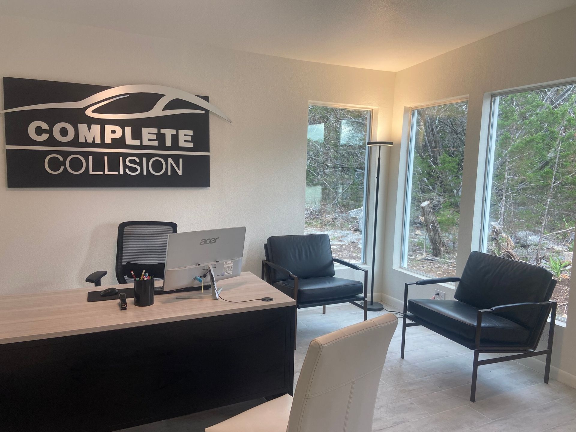 A complete collision office with a desk and chairs