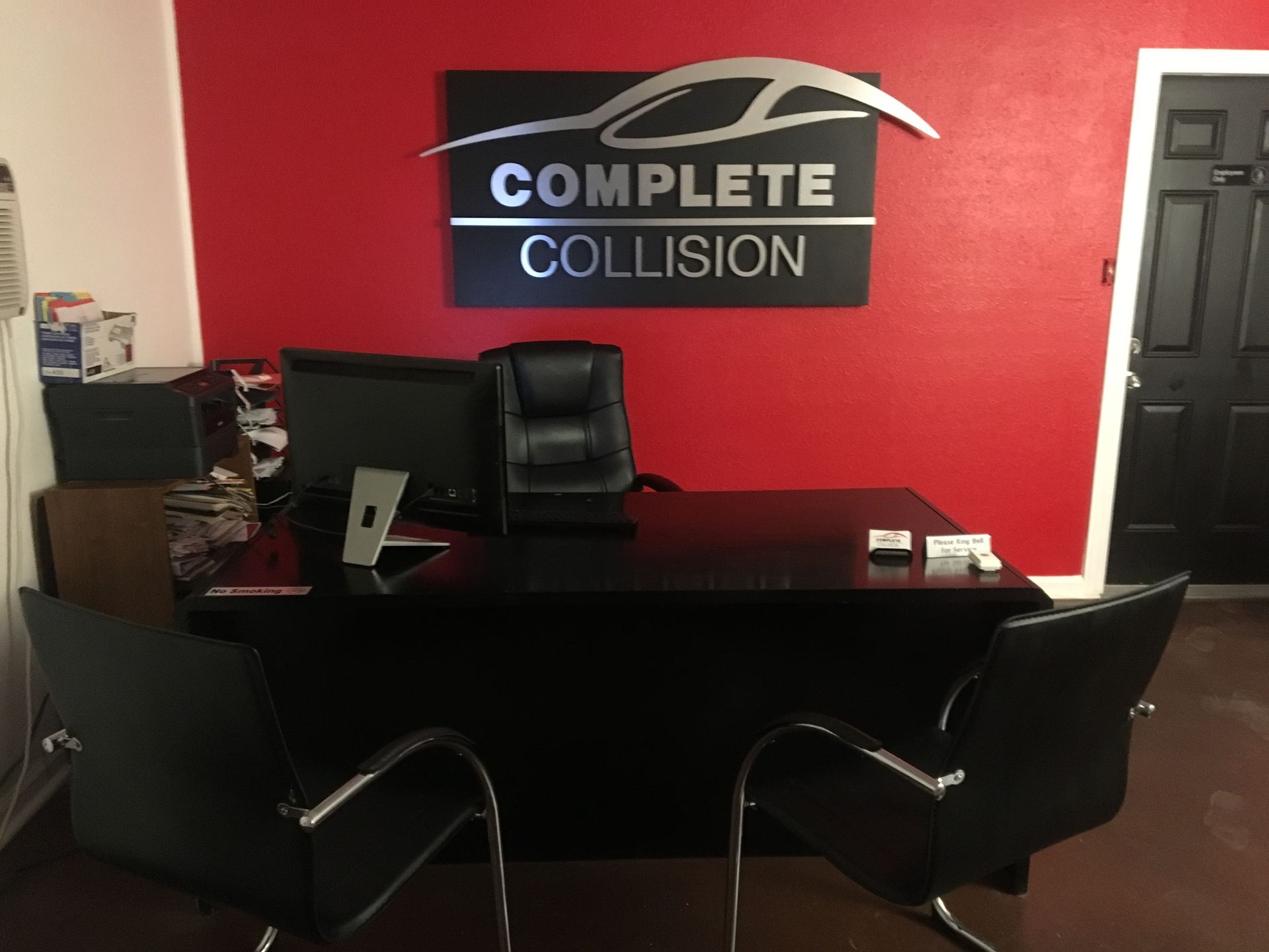 A complete collision office with a desk and chairs