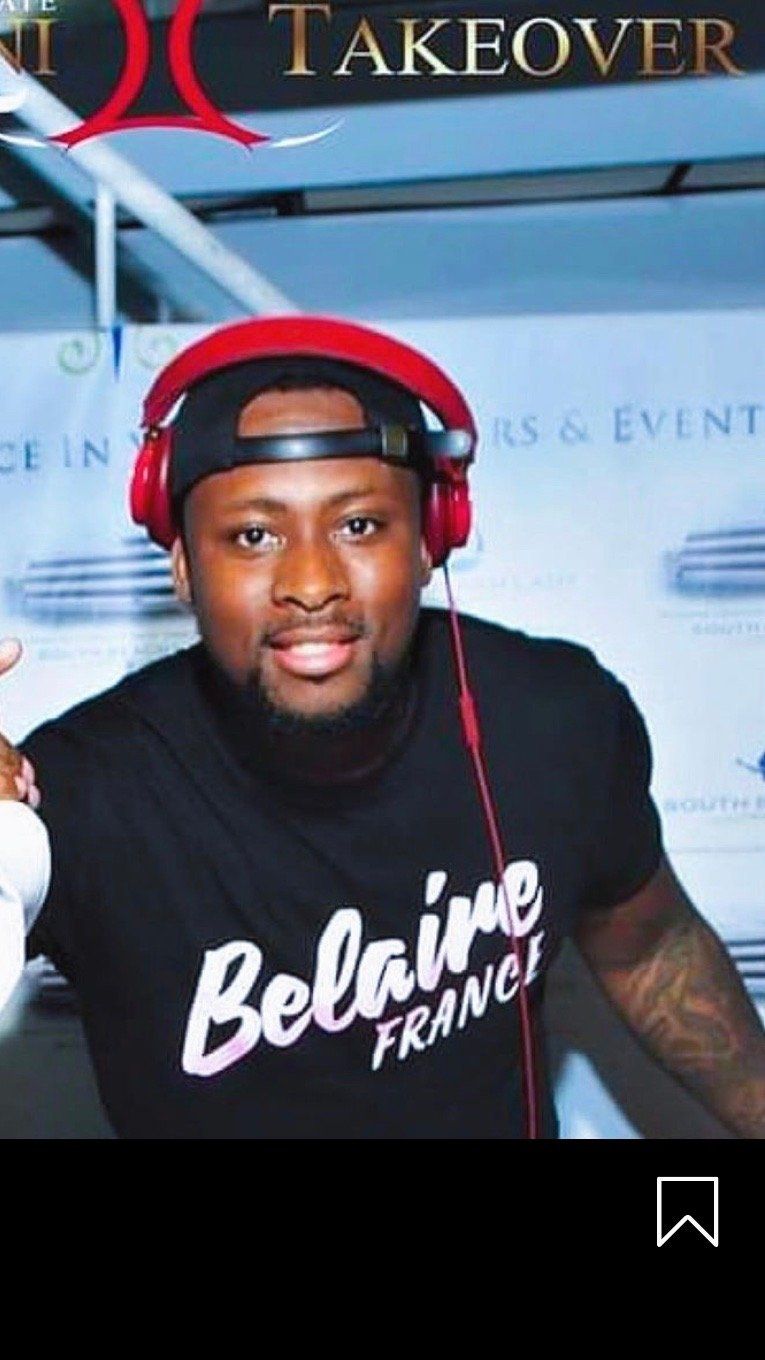 A man wearing headphones and a black shirt that says belaine france