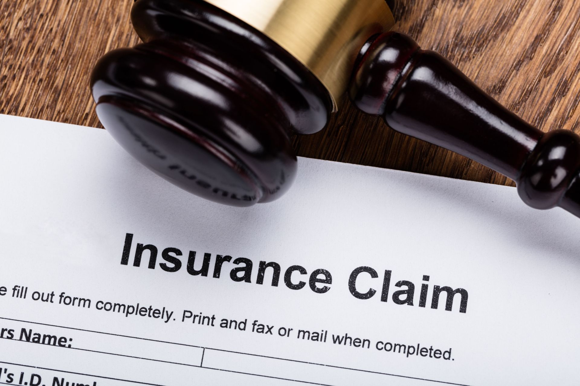 close wooden gavel on insurance claim