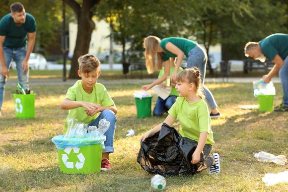 children collecting waste products