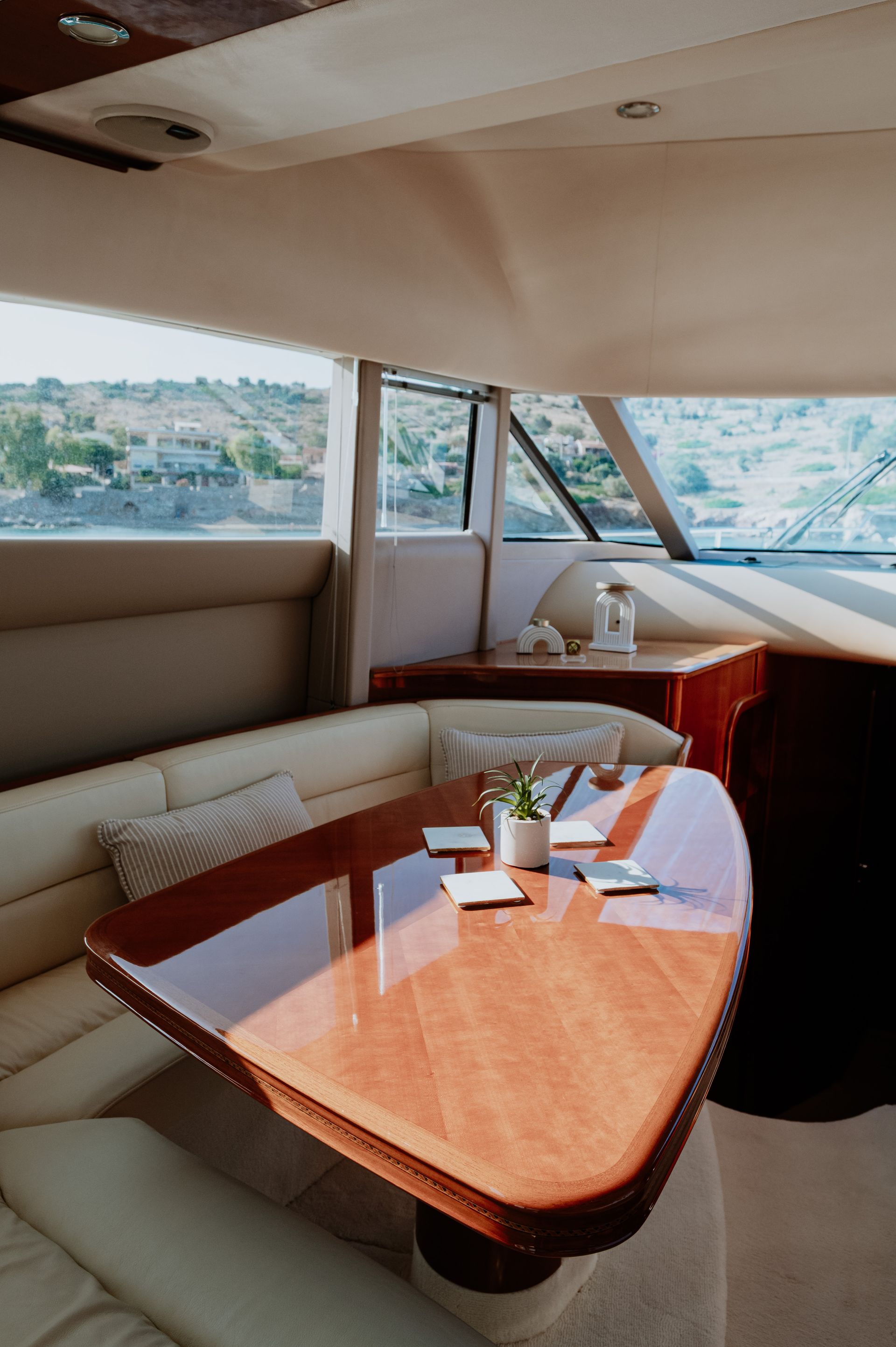 Calm ocean waters surrounding a yacht near shoreline
