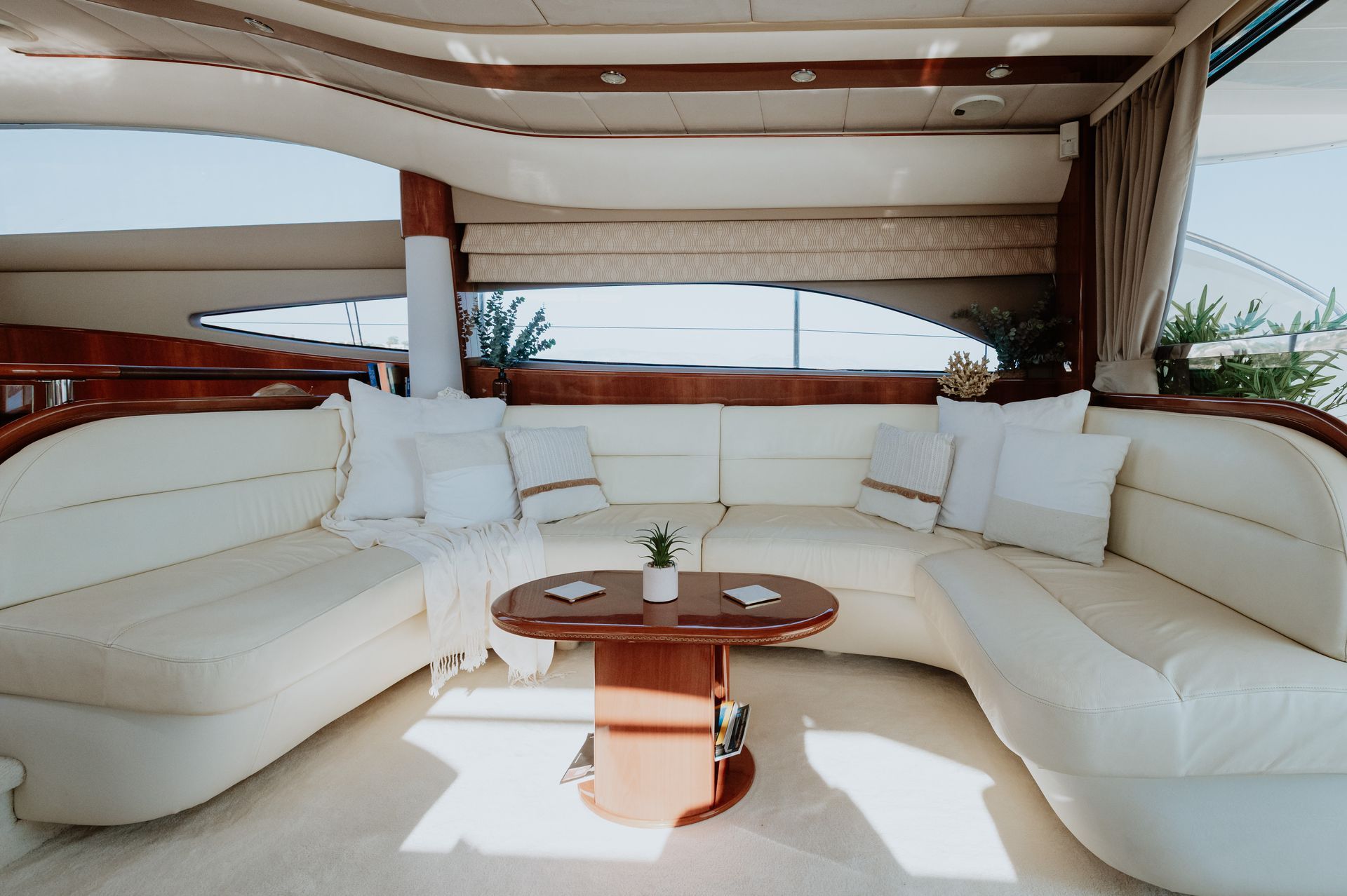 Comfortable seating area inside a premium charter yacht