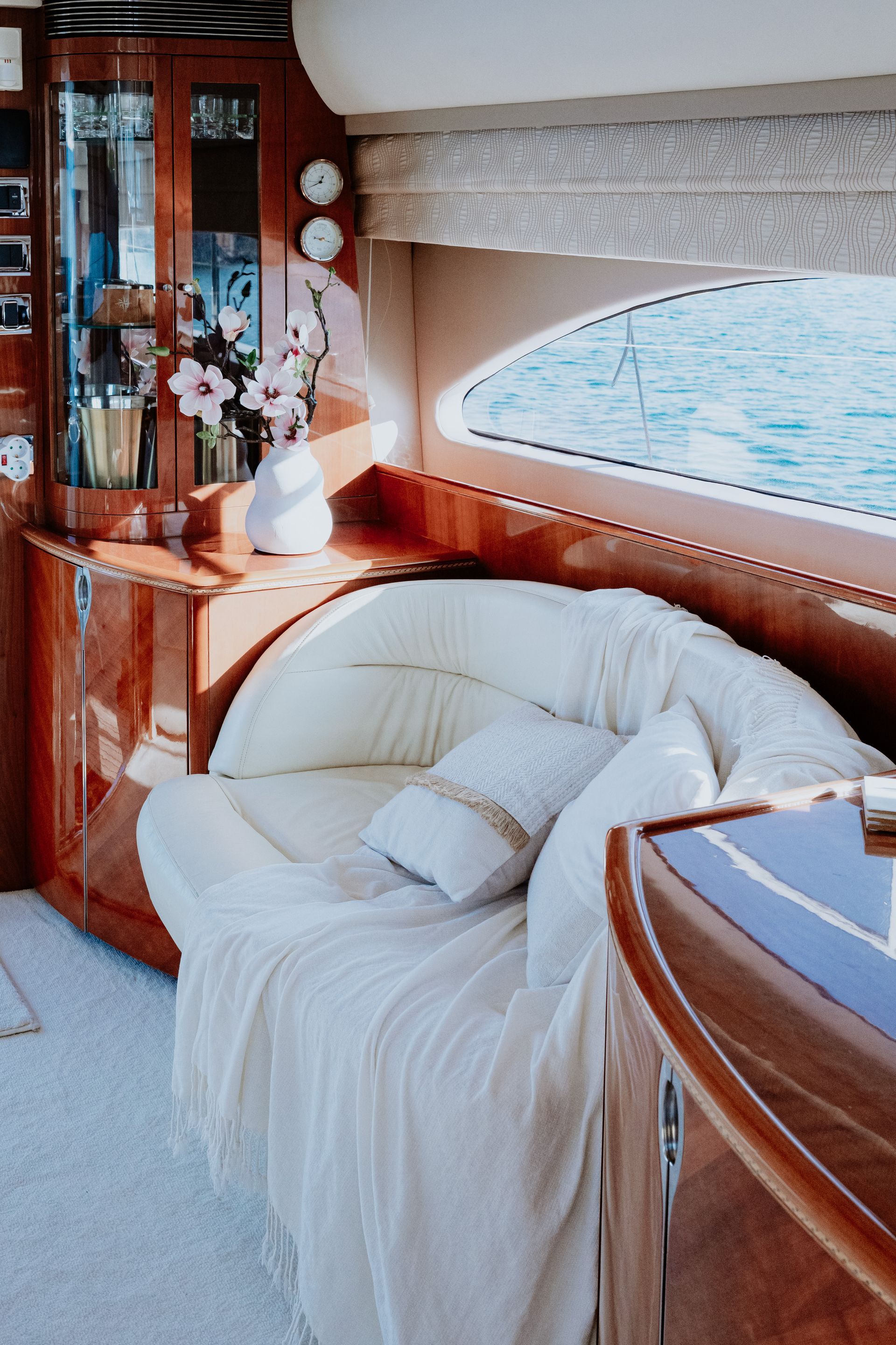 Private yacht exploring rugged coastal cliffs and open sea